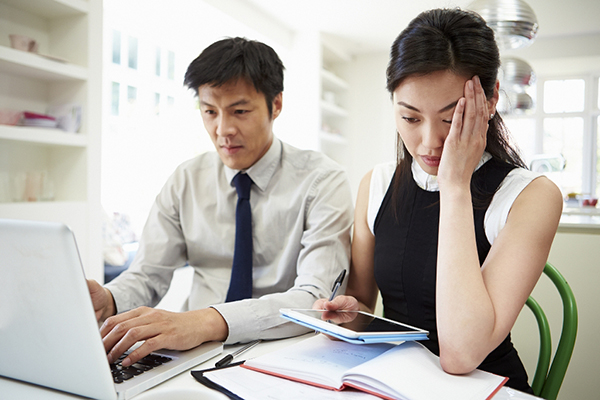 concerned asian couple